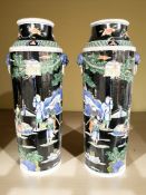 A pair of 20th century Chinese famille noire tapered cylindrical vases,