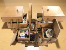 Two concertina sewing boxes and contents.