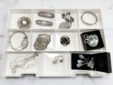A collection of silver/white metal jewellery including a Scottish hardstone brooch,