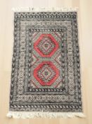 A Lahore Bokhara rug, Pakistan, 118 cm x 82 cm.