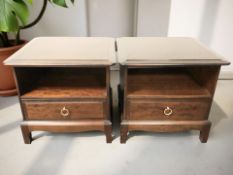 A pair of Stag Minstrel single drawer bedside chests, each 53 cm wide.
