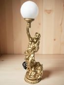 A reproduction gilt composition figural table lamp, height 74 cm.