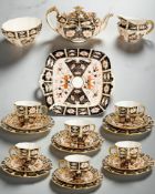 A Royal Crown Derby Imari tea service, pattern 2451, comprising teapot, milk jug, and sugar bowl,