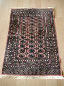 A Lahore Bokhara rug, Pakistan, 197 cm x 130 cm.