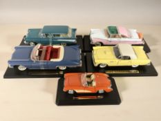 A Bburago Chevrolet Corvette (1957) die cast scale model on plinth,