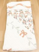 A machine stitched padded quilt.