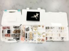 Three plastic cases of assorted costume jewellery, some silver items, Swatch watch,