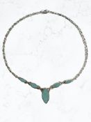 A silver and faux turquoise necklace CONDITION REPORT: 25.