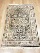 A Kashmir silk rug, 194 cm x 122 cm.