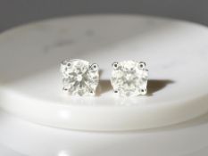 A pair of 18ct white gold brilliant-cut diamond stud earrings,