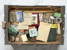 A group of collectibles to include box wood rulers, vintage tins, Snap Shot album, Ration Books,