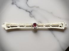A 10ct yellow gold Art Deco style garnet bar brooch CONDITION REPORT: 1.