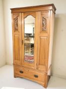 An Arts & Crafts satin walnut mirrored door wardrobe, 107 cm x 50 cm x 200 cm.