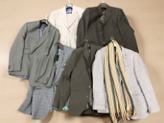 A group of gent's blazers and trousers.