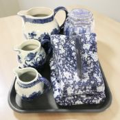 A Ringtons hexagonal blue and white cathedrals caddy, a graduated Victoria Ironstone set of jugs,