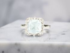 An aquamarine and diamond ring, in white gold, stamped 9K,