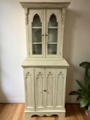 A 20th century painted pine bookcase in the gothic style,