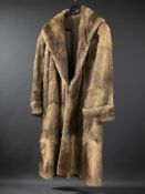 A lady's brown mink three quarter length coat.