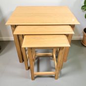 A modern oak nest of three tables, width 69 cm.