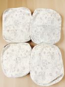 Four unused Ercol floral seat covers, two measuring 23
