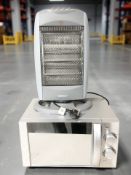 A Candy stainless steel microwave and a small Beldray electric heater.