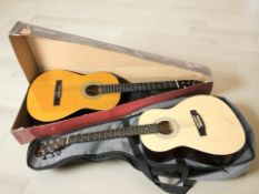 A classical guitar and a further redwood acoustic guitar.