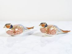A pair of Royal Crown Derby pheasant paperweights, with gold stoppers,