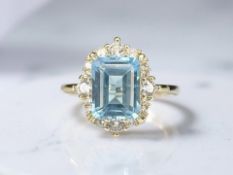 A silver gilt dress ring set with natural blue topaz, 4ct, size P, with AIG certificate.