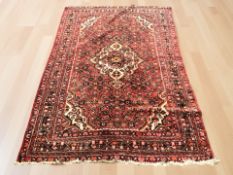 A Hamadan rug, North West Iran, 217 cm x 154 cm.