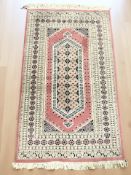 A Lahore Bokhara rug, Pakistan, 167 cm x 95 cm.