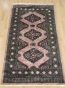 A Lahore Bokhara rug, Pakistan, 208 cm x 122 cm.