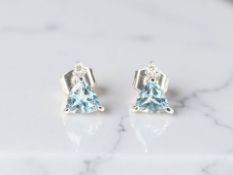 A pair of diamond and blue topaz ear studs, with post fittings CONDITION REPORT: 1.