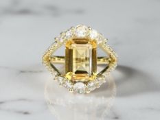 A gilt metal dress ring set with a natural citrine, 3ct, size P, with AIG certificate.