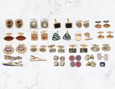 A collection of cuff links including a silver pair, other decorative gold plated examples,