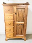 A contemporary pine compactum wardrobe, 108 cm x 55 cm x 177 cm.