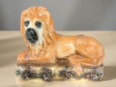 A Bridgeness ceramic lion, width 32 cm.