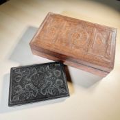 Two ornately-embossed leather jewellery boxes, the largest 40 cm wide.