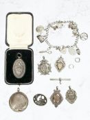 A group of silver items to include charm bracelet, Burns Club medal in case,