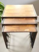 A teak nest of three tables, width 56 cm.