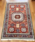 A Caucasian Kazak rug, 203 cm x 131 cm.