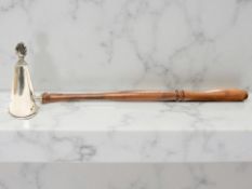 A silver candle snuffer with turned walnut handle, Laurence R Watson & Co, Birmingham 2000,