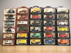 A collection of boxed Days Gone Vanguards die cast delivery vehicles.