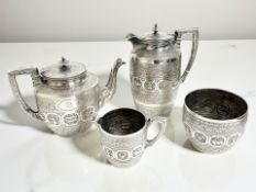 A good quality EPNS four-piece tea service, finely engraved and embossed with Eastern motifs,