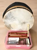 A bodhran, together with harmonicas, two recorders, etc.