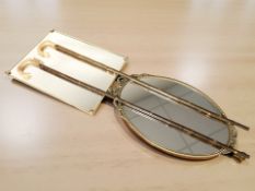 A reproduction gilt metal oval mirror,