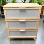 A modern wood effect three drawer chest, 80 cm x 40 cm x 100 cm.