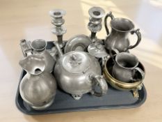A group of 18th century pewter wares including a pair of candlesticks, tea wares,