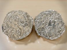 A pair of reproduction silvered composition Art Nouveau style wall plates, diameter 30 cm.