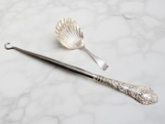A George III silver caddy spoon and a silver mounted button hook.