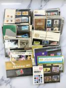 Approximately one hundred twenty British Post Office Mint stamp sets